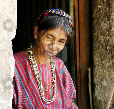 To use this stock image in your creative project, please select the size you need over to the right and click the "Add to Cart" button.
Your downloaded image will come with the Cutcaster watermark removed so don’t worry about the watermark you see on this page. Village Woman in Doorway stock photo, Lake Atitlan, Guatemala by Michael Cohen