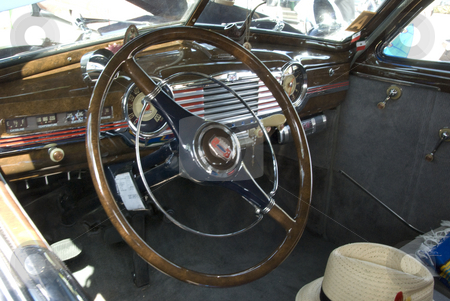 To use this stock image in your creative project, please select the size you need over to the right and click the "Add to Cart" button.
Your downloaded image will come with the Cutcaster watermark removed so don’t worry about the watermark you see on this page. Vintage Car Show stock photo, Wheel and other auto part at the mostly Chevy car show in Los Angeles, by Didier Tais