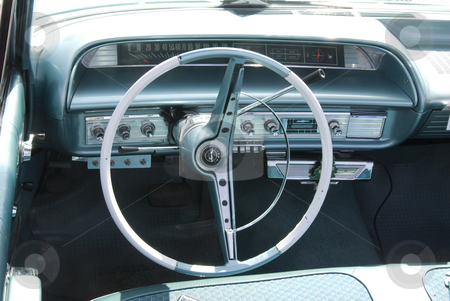 To use this stock image in your creative project, please select the size you need over to the right and click the "Add to Cart" button.
Your downloaded image will come with the Cutcaster watermark removed so don’t worry about the watermark you see on this page. Vintage Car Show stock photo, Wheel and other auto part at the mostly Chevy car show in Los Angeles, by Didier Tais