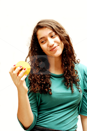 To use this stock image in your creative project, please select the size you need over to the right and click the "Add to Cart" button.
Your downloaded image will come with the Cutcaster watermark removed so don’t worry about the watermark you see on this page. Young girl and apple. stock photo, A pretty lady whit an green apple for her diet. by Horst Petzold