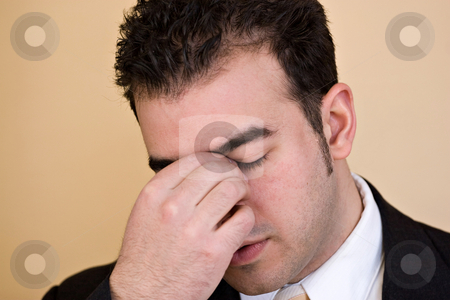 To use this stock image in your creative project, please select the size you need over to the right and click the "Add to Cart" button.
Your downloaded image will come with the Cutcaster watermark removed so don’t worry about the watermark you see on this page. Man With a Headache stock photo, Young man with a headache. He might be experiencing intense stress over a time of economic downturn or other financial hardship. by Todd Arena