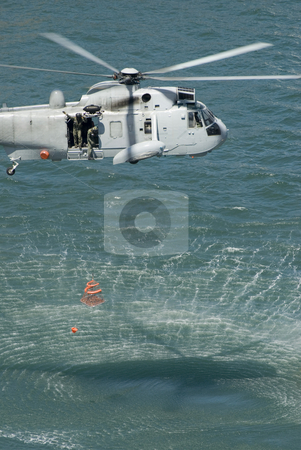To use this stock image in your creative project, please select the size you need over to the right and click the "Add to Cart" button.
Your downloaded image will come with the Cutcaster watermark removed so don’t worry about the watermark you see on this page. Rescue Helicopter stock photo, An Australian navy sea king helicopter practising a rescue by Stephen Gibson