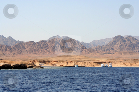 To use this stock image in your creative project, please select the size you need over to the right and click the "Add to Cart" button.
Your downloaded image will come with the Cutcaster watermark removed so don’t worry about the watermark you see on this page. Red Sea Coastal View stock photo, Showing the barren desert region of the Sinai Peninsula around the Red Sea, Egypt by Helen Shorey