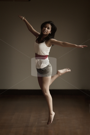 To use this stock image in your creative project, please select the size you need over to the right and click the "Add to Cart" button.
Your downloaded image will come with the Cutcaster watermark removed so don’t worry about the watermark you see on this page. Portrait of an Indonesian girl jumping stock photo, Jumping and dancing beautifull Indonesian girl by Frenk and Danielle Kaufmann