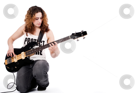 To use this stock image in your creative project, please select the size you need over to the right and click the "Add to Cart" button.
Your downloaded image will come with the Cutcaster watermark removed so don’t worry about the watermark you see on this page. Me and my music stock photo, Young female bass guitar player specially isolated on white by Frenk and Danielle Kaufmann
