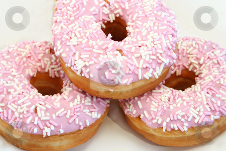 To use this stock image in your creative project, please select the size you need over to the right and click the "Add to Cart" button.
Your downloaded image will come with the Cutcaster watermark removed so don’t worry about the watermark you see on this page. Three Iced Donuts stock photo, Close up of three iced donuts with sprinkles by Helen Shorey
