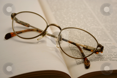 To use this stock image in your creative project, please select the size you need over to the right and click the "Add to Cart" button.
Your downloaded image will come with the Cutcaster watermark removed so don’t worry about the watermark you see on this page. Reading Glasses on an Old Book stock photo, Pair of reading glasses on an old book, some text is legible by Helen Shorey