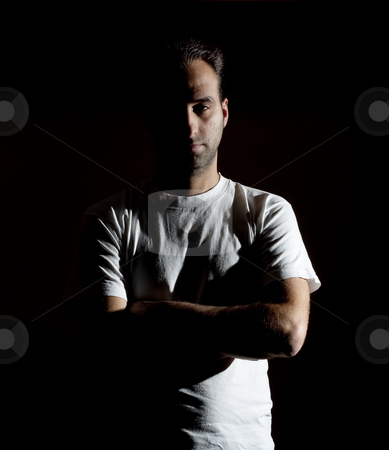 To use this stock image in your creative project, please select the size you need over to the right and click the "Add to Cart" button.
Your downloaded image will come with the Cutcaster watermark removed so don’t worry about the watermark you see on this page. Rude mistery man stock photo, Dark image of a no shaved dangerous looking guy in a rude pose by Ivan Montero