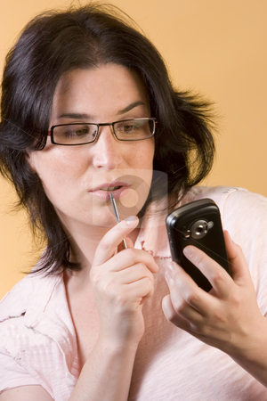 To use this stock image in your creative project, please select the size you need over to the right and click the "Add to Cart" button.
Your downloaded image will come with the Cutcaster watermark removed so don’t worry about the watermark you see on this page. Young woman communication technology stock photo, Young woman by Ivan Montero