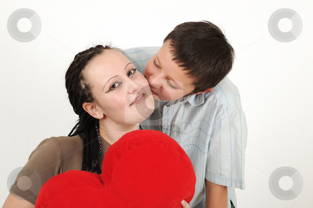 To use this stock image in your creative project, please select the size you need over to the right and click the "Add to Cart" button.
Your downloaded image will come with the Cutcaster watermark removed so don’t worry about the watermark you see on this page. Young boy and girl stock photo, Young boy and girl with red heart by Tom P.
