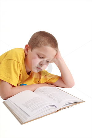 To use this stock image in your creative project, please select the size you need over to the right and click the "Add to Cart" button.
Your downloaded image will come with the Cutcaster watermark removed so don’t worry about the watermark you see on this page. Young boy lying down stock photo, Young boy is reading the book - on white background by Tom P.