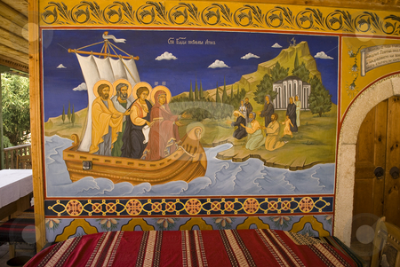 To use this stock image in your creative project, please select the size you need over to the right and click the "Add to Cart" button.
Your downloaded image will come with the Cutcaster watermark removed so don’t worry about the watermark you see on this page. Icon paintings in monastery interior stock photo, Iconography painted icons with saints on monastery wall by Desislava Dimitrova