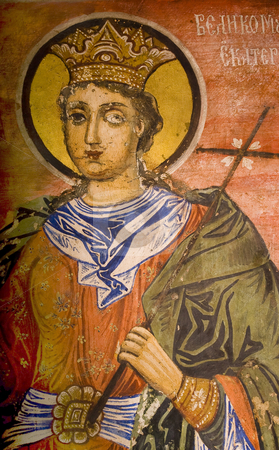 To use this stock image in your creative project, please select the size you need over to the right and click the "Add to Cart" button.
Your downloaded image will come with the Cutcaster watermark removed so don’t worry about the watermark you see on this page. Icon paintings in monastery interior stock photo, Iconography painted icons with saints on monastery wall by Desislava Dimitrova