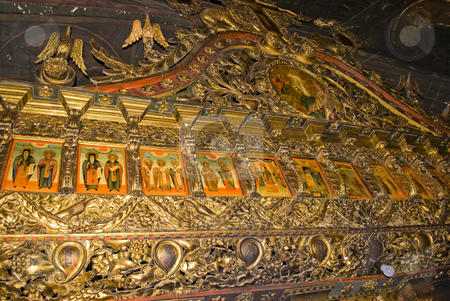 To use this stock image in your creative project, please select the size you need over to the right and click the "Add to Cart" button.
Your downloaded image will come with the Cutcaster watermark removed so don’t worry about the watermark you see on this page. Icon paintings in monastery interior stock photo, Iconography painted icons with saints on monastery wall by Desislava Dimitrova