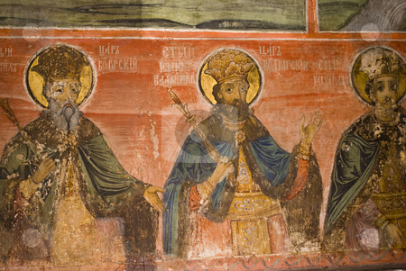 To use this stock image in your creative project, please select the size you need over to the right and click the "Add to Cart" button.
Your downloaded image will come with the Cutcaster watermark removed so don’t worry about the watermark you see on this page. Icon paintings in monastery interior stock photo, Iconography painted icons with saints on monastery wall by Desislava Dimitrova