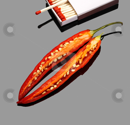 To use this stock image in your creative project, please select the size you need over to the right and click the "Add to Cart" button.
Your downloaded image will come with the Cutcaster watermark removed so don’t worry about the watermark you see on this page. Red chili peppers stock photo, Fresh red chili peppers with matches over grey reflective surface by Francesco Perre