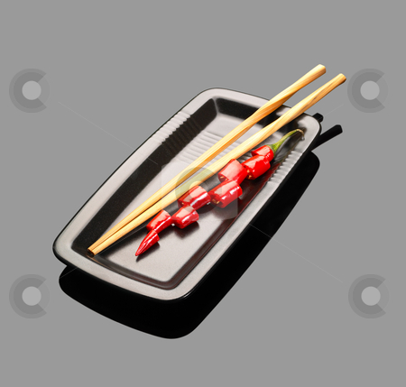 To use this stock image in your creative project, please select the size you need over to the right and click the "Add to Cart" button.
Your downloaded image will come with the Cutcaster watermark removed so don’t worry about the watermark you see on this page. Red chili peppers stock photo, Fresh red chili peppers on a plate with chopstikcs over grey reflective surface by Francesco Perre