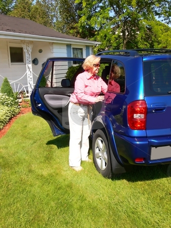 To use this stock image in your creative project, please select the size you need over to the right and click the "Add to Cart" button.
Your downloaded image will come with the Cutcaster watermark removed so don’t worry about the watermark you see on this page. Lady with blue car stock photo, An senior citizen with her new blue SUV on the front lawn of her house. by Horst Petzold