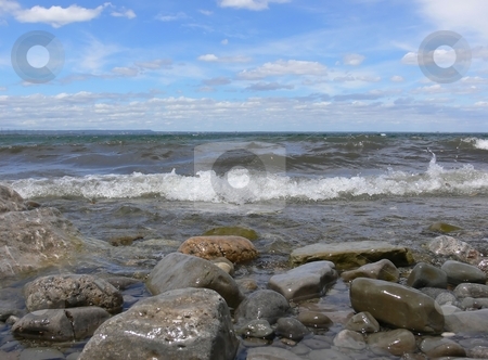To use this stock image in your creative project, please select the size you need over to the right and click the "Add to Cart" button.
Your downloaded image will come with the Cutcaster watermark removed so don’t worry about the watermark you see on this page. Waves on the lake stock photo, Waves rolling on the lake shore on an beautiful sunny day with some
white clouds on the blue sky. by Horst Petzold