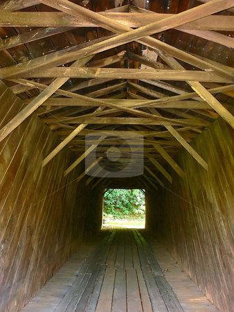 To use this stock image in your creative project, please select the size you need over to the right and click the "Add to Cart" button.
Your downloaded image will come with the Cutcaster watermark removed so don’t worry about the watermark you see on this page. Closed wooden bridge stock photo, A closed antique wooden bridge over a river in the mountains of Virginia
from the inside. by Horst Petzold