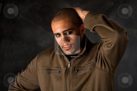 To use this stock image in your creative project, please select the size you need over to the right and click the "Add to Cart" button.
Your downloaded image will come with the Cutcaster watermark removed so don’t worry about the watermark you see on this page. Dramatic Hispanic guy stock photo, Handsome African Hispanic guy frowning with strong macho expression and dark eyes in green vest and hand on head by Paul Hakimata