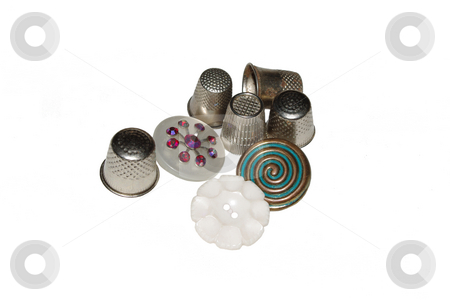 To use this stock image in your creative project, please select the size you need over to the right and click the "Add to Cart" button.
Your downloaded image will come with the Cutcaster watermark removed so don’t worry about the watermark you see on this page. Thimbles and Buttons stock photo, Vintage metal thimbles and buttons on a white background by Sandra Fann