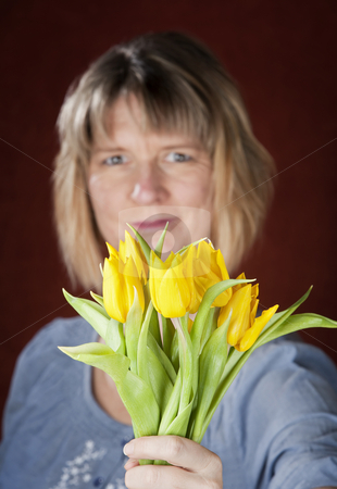 To use this stock image in your creative project, please select the size you need over to the right and click the "Add to Cart" button.
Your downloaded image will come with the Cutcaster watermark removed so don’t worry about the watermark you see on this page. Woman with Yellow Tulips stock photo, Pretty woman with a bunch of yellow tulips by Scott Griessel
