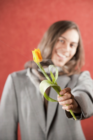To use this stock image in your creative project, please select the size you need over to the right and click the "Add to Cart" button.
Your downloaded image will come with the Cutcaster watermark removed so don’t worry about the watermark you see on this page. Handsome Young Man with Yellow Tulip stock photo, Closeup Portrait of a Handsome Young Man with Yellow Tulip by Scott Griessel