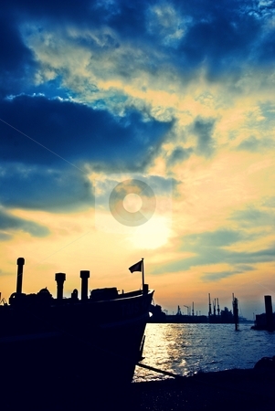 To use this stock image in your creative project, please select the size you need over to the right and click the "Add to Cart" button.
Your downloaded image will come with the Cutcaster watermark removed so don’t worry about the watermark you see on this page. Sunset at the docks stock photo, View at the harbor Hamburg, Germany by Diana Hartmann