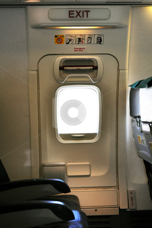 To use this stock image in your creative project, please select the size you need over to the right and click the "Add to Cart" button.
Your downloaded image will come with the Cutcaster watermark removed so don’t worry about the watermark you see on this page. Emergency exit door. stock photo, Emergency exit row. Passenger cabin of a commercial airliner by Fernando Barozza