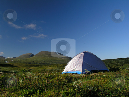 To use this stock image in your creative project, please select the size you need over to the right and click the "Add to Cart" button.
Your downloaded image will come with the Cutcaster watermark removed so don’t worry about the watermark you see on this page. Camping stock photo, Camping in the mountains by Ingvar Bjork