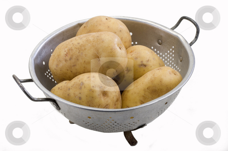 To use this stock image in your creative project, please select the size you need over to the right and click the "Add to Cart" button.
Your downloaded image will come with the Cutcaster watermark removed so don’t worry about the watermark you see on this page. Potatoes stock photo, Potatoes in a metal colander on white by Jonathan Hull