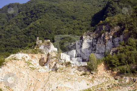To use this stock image in your creative project, please select the size you need over to the right and click the "Add to Cart" button.
Your downloaded image will come with the Cutcaster watermark removed so don’t worry about the watermark you see on this page. Quarry of white marble stock photo, An open quarry of white marble in Carrara, Tuscany, Italy by Roberto Marinello