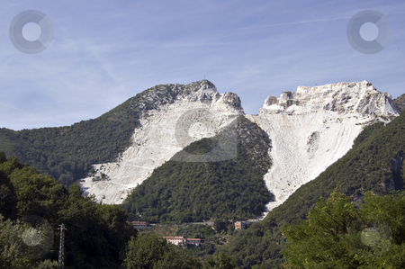 To use this stock image in your creative project, please select the size you need over to the right and click the "Add to Cart" button.
Your downloaded image will come with the Cutcaster watermark removed so don’t worry about the watermark you see on this page. Quarry of white marble stock photo, An open quarry of white marble in Carrara, Tuscany, Italy by Roberto Marinello
