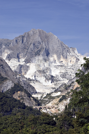 To use this stock image in your creative project, please select the size you need over to the right and click the "Add to Cart" button.
Your downloaded image will come with the Cutcaster watermark removed so don’t worry about the watermark you see on this page. Quarry of white marble stock photo, An open quarry of white marble in Carrara, Tuscany, Italy by Roberto Marinello
