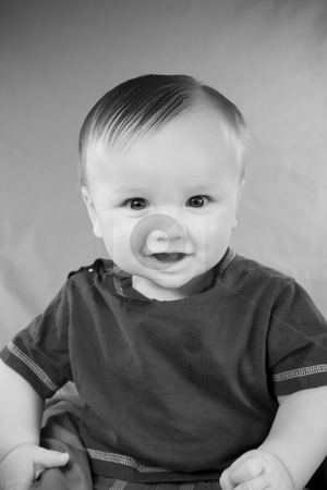 To use this stock image in your creative project, please select the size you need over to the right and click the "Add to Cart" button.
Your downloaded image will come with the Cutcaster watermark removed so don’t worry about the watermark you see on this page. Cute Baby Boy stock photo, A portrait of a cute five month old baby boy. Shallow depth of field. by Travis Manley