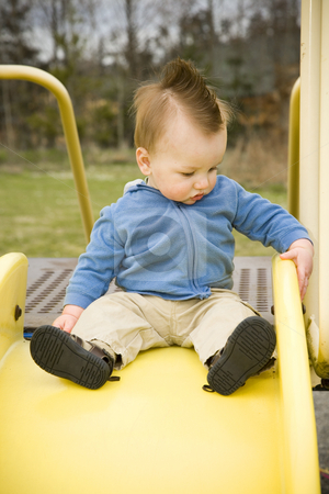 To use this stock image in your creative project, please select the size you need over to the right and click the "Add to Cart" button.
Your downloaded image will come with the Cutcaster watermark removed so don’t worry about the watermark you see on this page. Happy Boy on Slide stock photo, A portrait of a happy boy on a slide in a playground. by Travis Manley