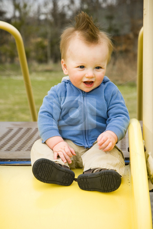 To use this stock image in your creative project, please select the size you need over to the right and click the "Add to Cart" button.
Your downloaded image will come with the Cutcaster watermark removed so don’t worry about the watermark you see on this page. Happy Boy on Slide stock photo, A portrait of a happy boy on a slide in a playground. by Travis Manley