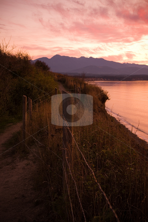 To use this stock image in your creative project, please select the size you need over to the right and click the "Add to Cart" button.
Your downloaded image will come with the Cutcaster watermark removed so don’t worry about the watermark you see on this page. Strait of Juan de Fuca Sunset stock photo, A beautiful sunset over the Strait of Juan de Fuca in Sequim, Washington. by Travis Manley