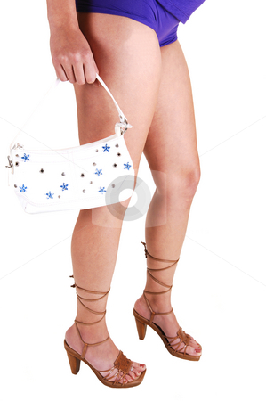 To use this stock image in your creative project, please select the size you need over to the right and click the "Add to Cart" button.
Your downloaded image will come with the Cutcaster watermark removed so don’t worry about the watermark you see on this page. The legs of a young girl. stock photo, A young woman standing for white background in purple panties, high
heels with an handbag in her hand. by Horst Petzold