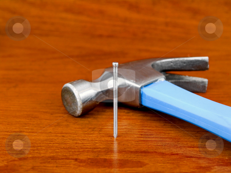 To use this stock image in your creative project, please select the size you need over to the right and click the "Add to Cart" button.
Your downloaded image will come with the Cutcaster watermark removed so don’t worry about the watermark you see on this page. Hammer and nail on wooden background stock photo, Hammer and nail on a wooden background by John Teeter