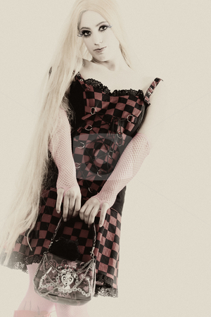 To use this stock image in your creative project, please select the size you need over to the right and click the "Add to Cart" button.
Your downloaded image will come with the Cutcaster watermark removed so don’t worry about the watermark you see on this page. Antique girl with long hair dressed harajuku style stock photo, Studio shot of a young girl dressed up like japanese harajuku style girls by Frenk and Danielle Kaufmann