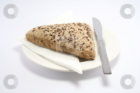 To use this stock image in your creative project, please select the size you need over to the right and click the "Add to Cart" button.
Your downloaded image will come with the Cutcaster watermark removed so don’t worry about the watermark you see on this page. Sesame Seed Bread Roll stock photo, Seeded bread roll on a plate with paper napkin and knife by Helen Shorey