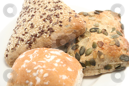 To use this stock image in your creative project, please select the size you need over to the right and click the "Add to Cart" button.
Your downloaded image will come with the Cutcaster watermark removed so don’t worry about the watermark you see on this page. Close up of Bread Rolls stock photo, Sesame seed, pumpkin seed and plain white rolls on a plate - closeup by Helen Shorey