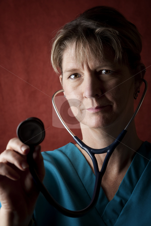 To use this stock image in your creative project, please select the size you need over to the right and click the "Add to Cart" button.
Your downloaded image will come with the Cutcaster watermark removed so don’t worry about the watermark you see on this page. Medical Professional stock photo, Female medical professional in scrubs with stethoscope by Scott Griessel