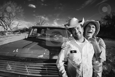 To use this stock image in your creative project, please select the size you need over to the right and click the "Add to Cart" button.
Your downloaded image will come with the Cutcaster watermark removed so don’t worry about the watermark you see on this page. Couple with a Pickup Truck stock photo, Man and woman in cowboy hats with old truck by Scott Griessel