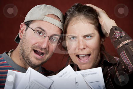 To use this stock image in your creative project, please select the size you need over to the right and click the "Add to Cart" button.
Your downloaded image will come with the Cutcaster watermark removed so don’t worry about the watermark you see on this page. Couple with too many bills stock photo, Young couple upset over too many bills by Scott Griessel