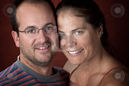 To use this stock image in your creative project, please select the size you need over to the right and click the "Add to Cart" button.
Your downloaded image will come with the Cutcaster watermark removed so don’t worry about the watermark you see on this page. Attractive Couple stock photo, Closeup portrait of an attractive young couple by Scott Griessel