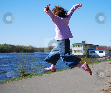 To use this stock image in your creative project, please select the size you need over to the right and click the "Add to Cart" button.
Your downloaded image will come with the Cutcaster watermark removed so don’t worry about the watermark you see on this page. Flying child stock photo, Jumping girl in blue jeans, pink shoes and lilac pullover against water background by Leyla Akhundova