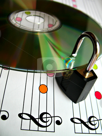 To use this stock image in your creative project, please select the size you need over to the right and click the "Add to Cart" button.
Your downloaded image will come with the Cutcaster watermark removed so don’t worry about the watermark you see on this page. Music piracy protection stock photo, Concept image about music piracy and copyright protection by Roberto Marinello